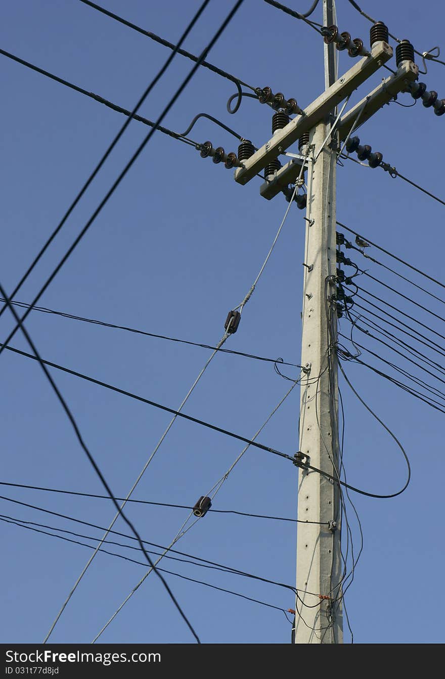 Power lines and illuminated street light, low angle view