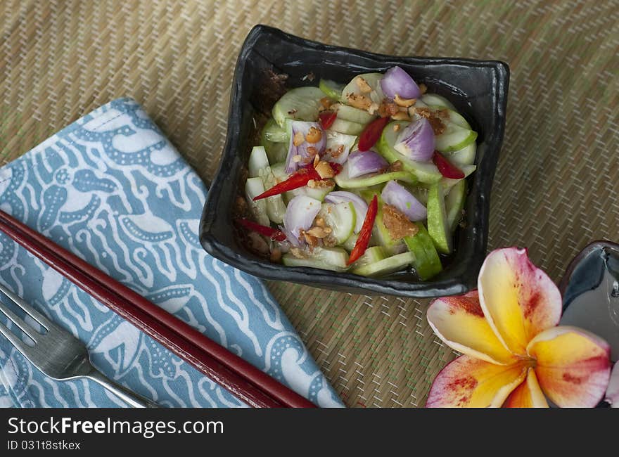 Thai cucumber salsa as accompaniment to Thai fishcakes