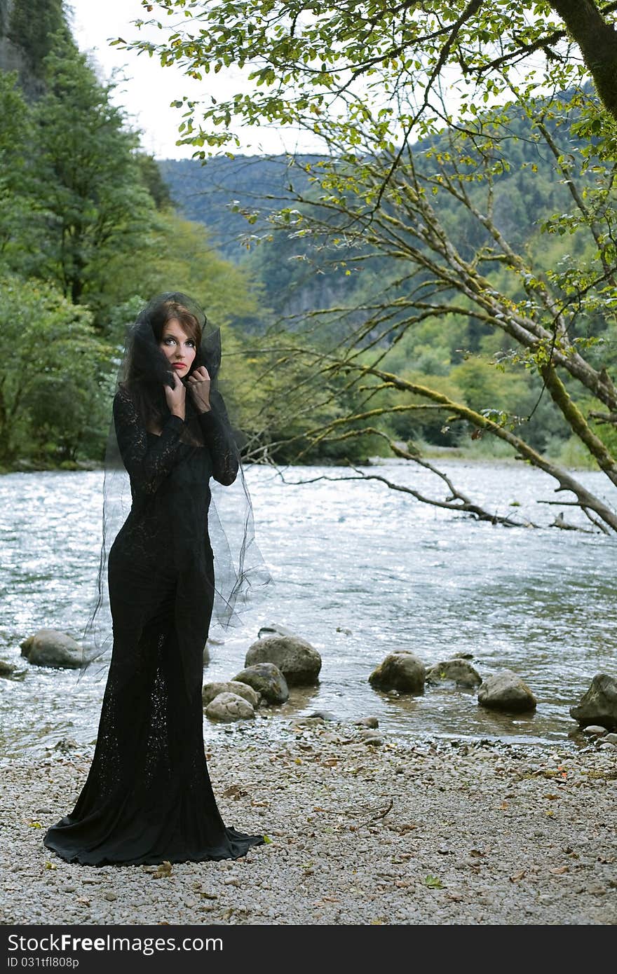 Beauty woman in dress in forest