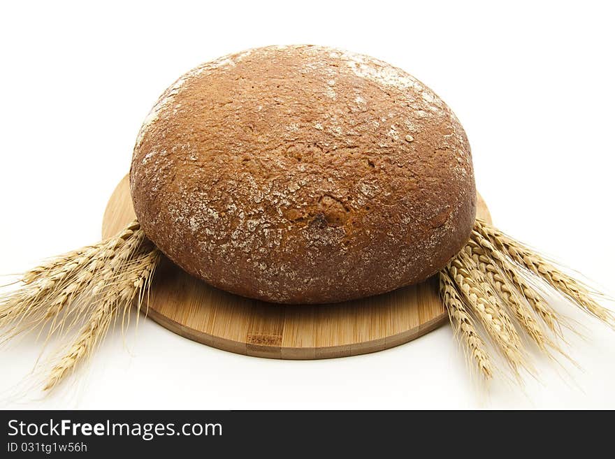 Round bread with wheat ears