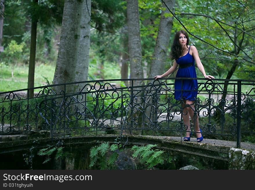 Beauty woman on rock river