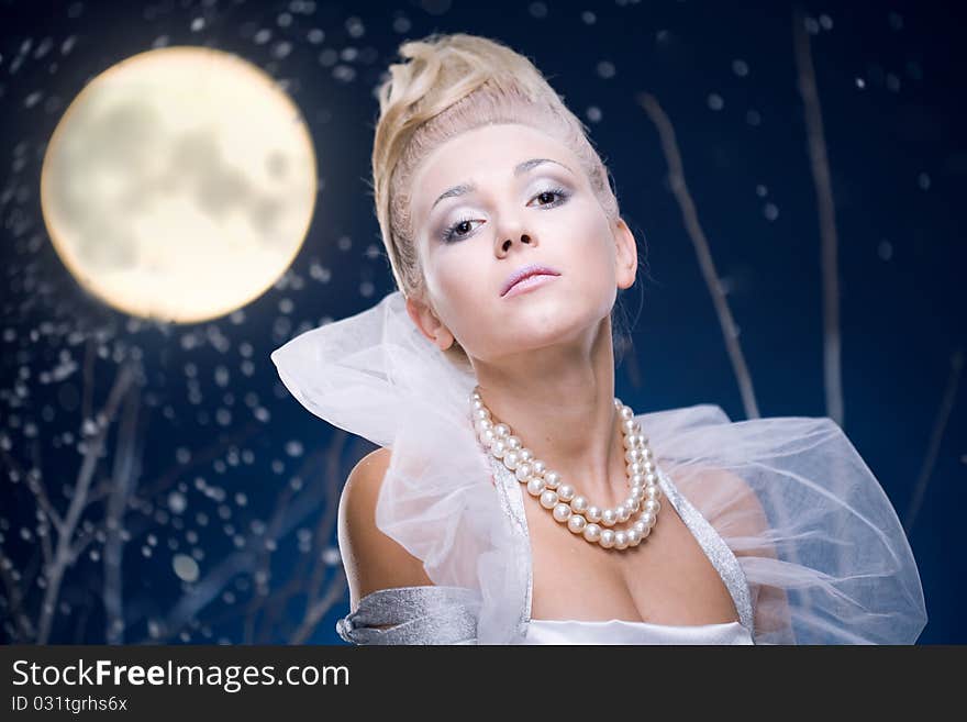 Beauty woman under moon in winter season. Beauty woman under moon in winter season