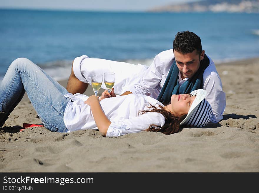 Happy Young Couple Have Fun At Beautiful Beach