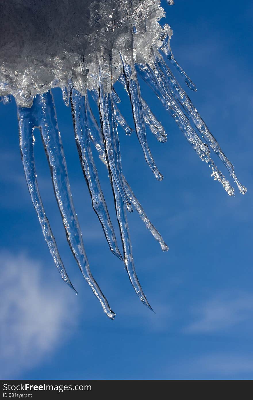 Icicles hanging from windblown snow