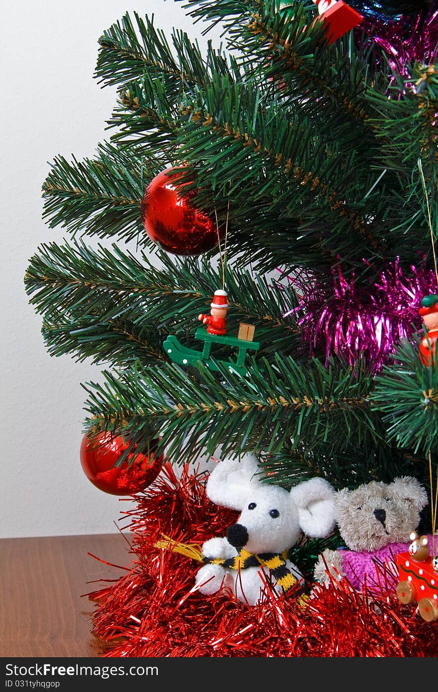 Christmas trinkets hanging on fir tree. Christmas trinkets hanging on fir tree