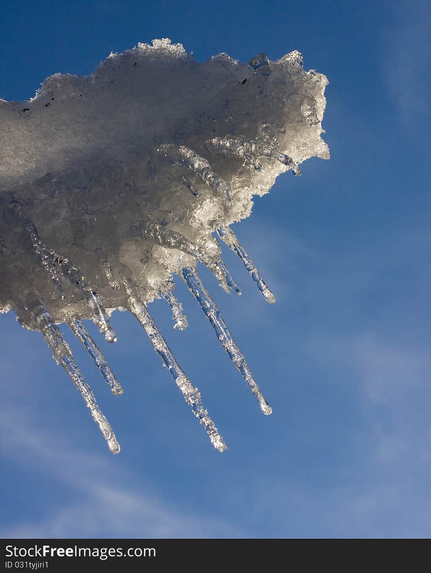 Icicles hanging from windblown snow