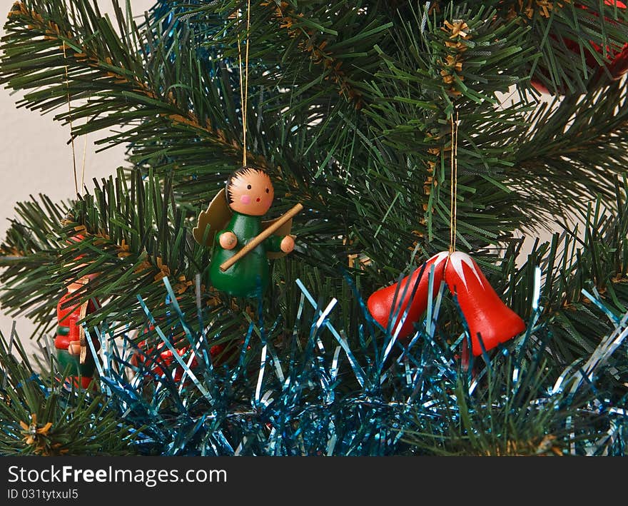 Wooden fairy and bells on the christmas tree. Wooden fairy and bells on the christmas tree