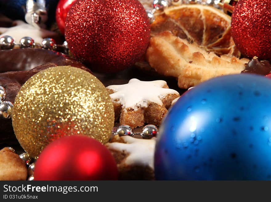 Christmas still-life with some balls and typical cookies ans sweets