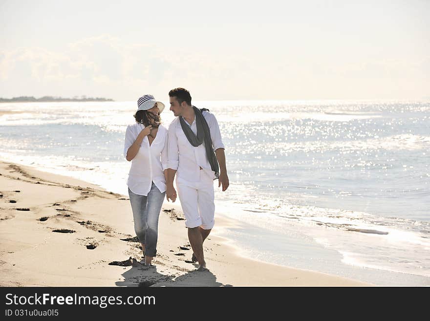 Happy young couple have fun at beautiful beach