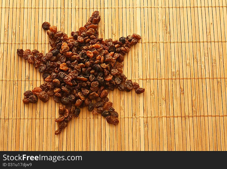 Raisins in the form of a sun/star, background