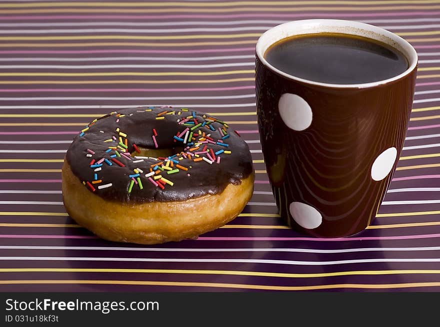 Chocolate iced donut and coffee