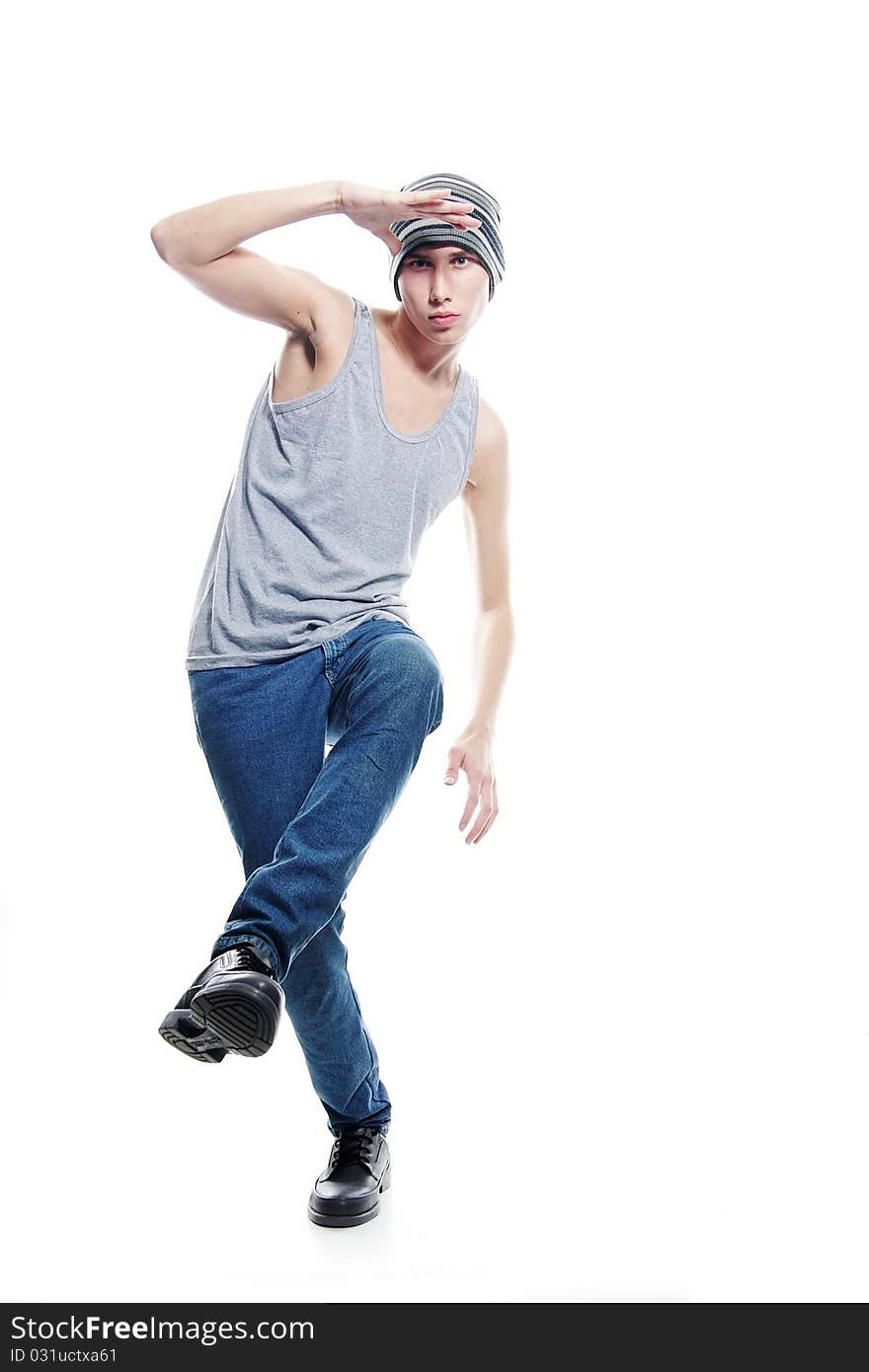 Studio portrait of young hip-hop dancer over white