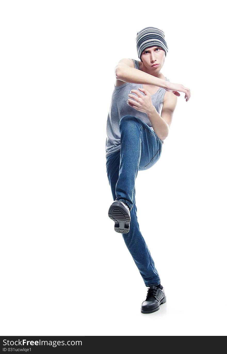 Studio portrait of young hip-hop dancer over white