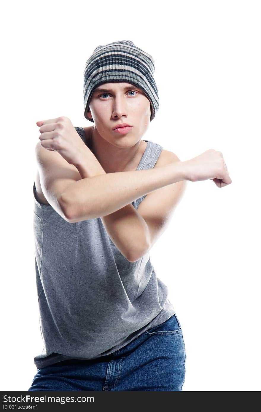 Studio portrait of young hip-hop dancer over white