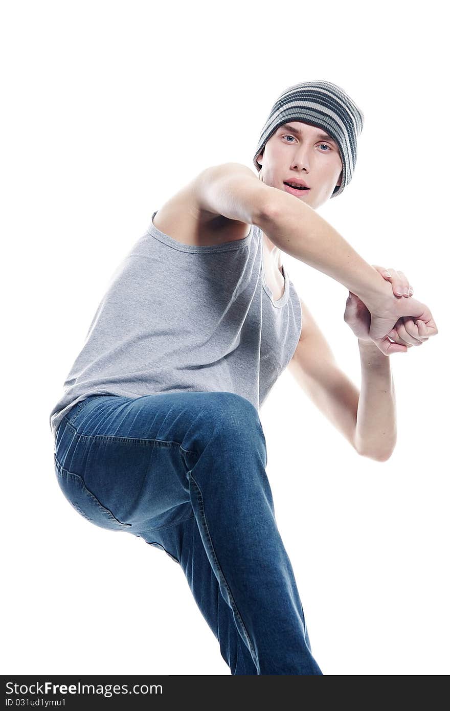 Studio portrait of young hip-hop dancer over white