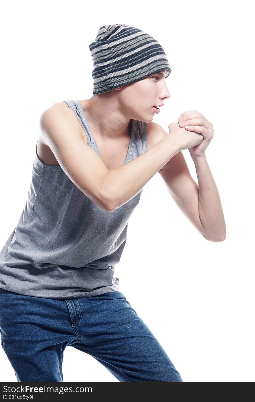 Studio portrait of young hip-hop dancer over white