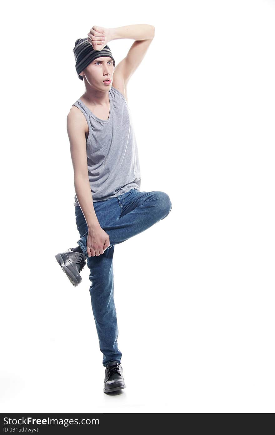 Studio portrait of young hip-hop dancer over white