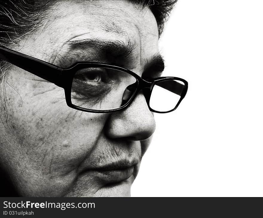 Dramatic black and white portrait of a woman with glasses