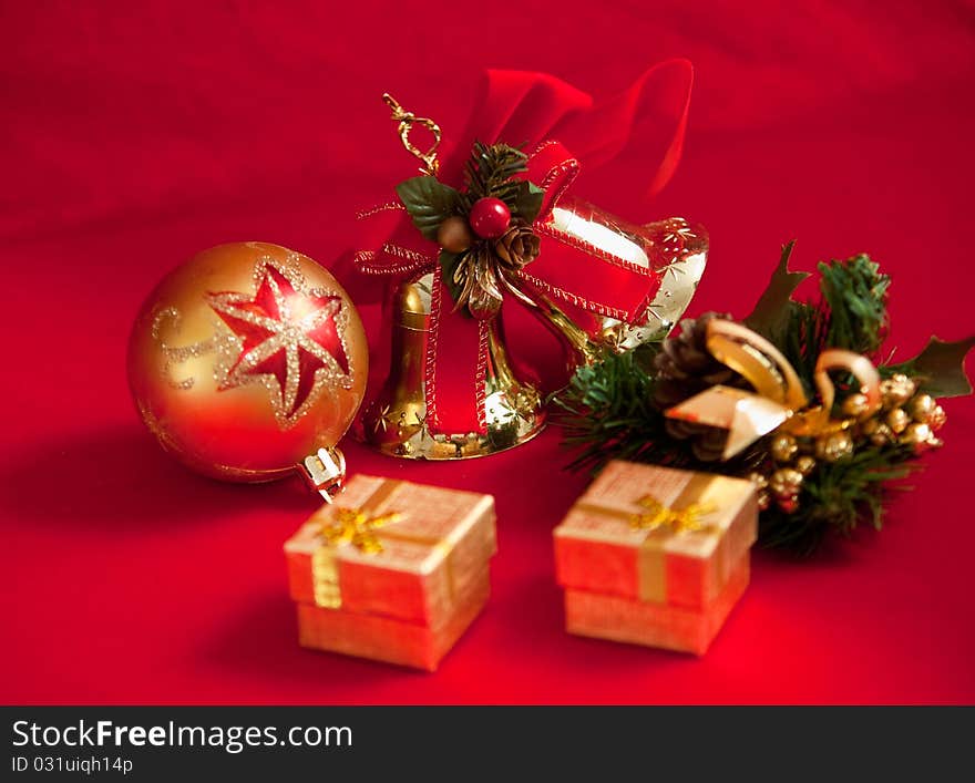 Christmas decoration with bell on red background . Christmas decoration with bell on red background .