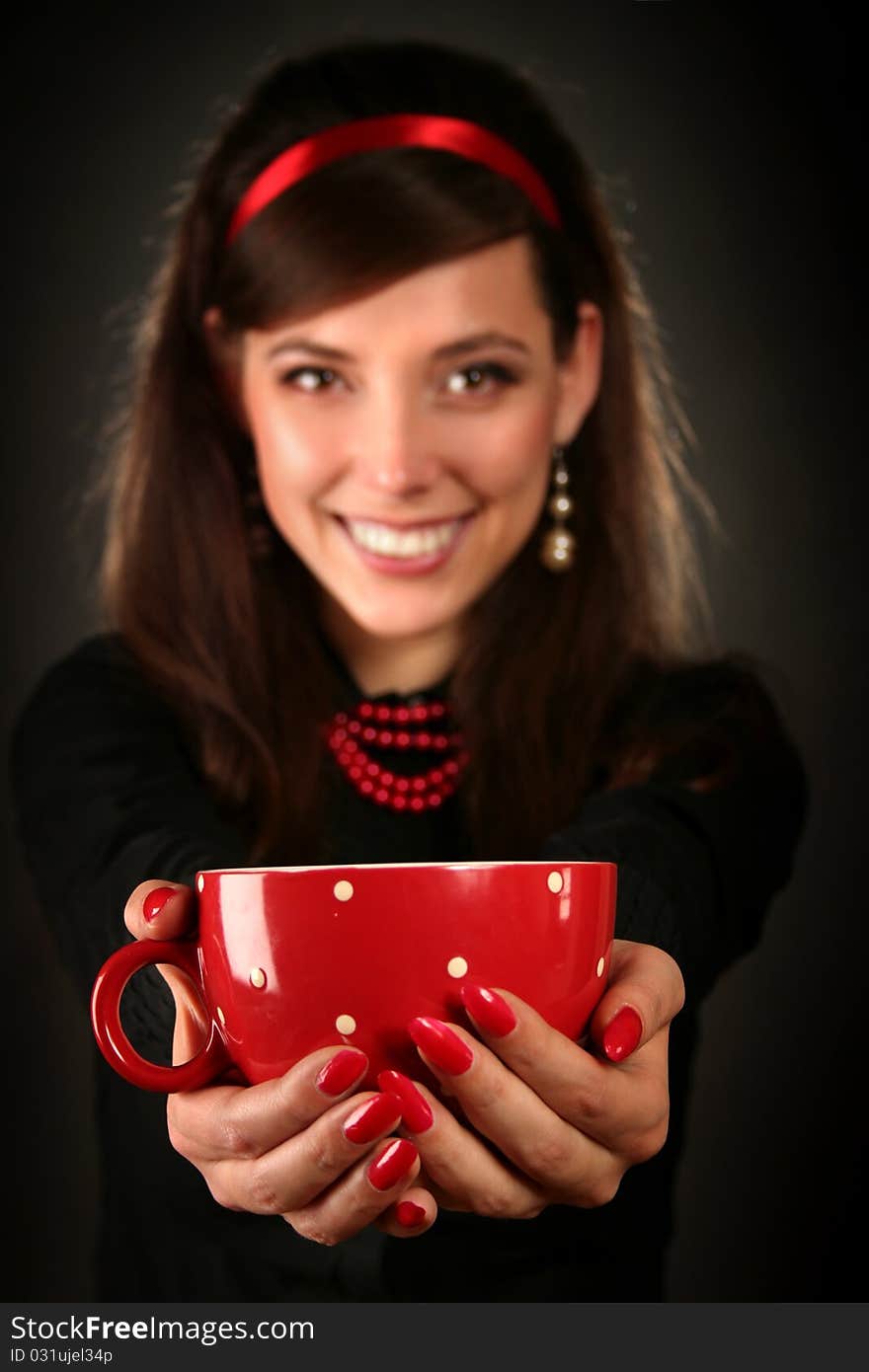 Beautiful retro woman with red cup