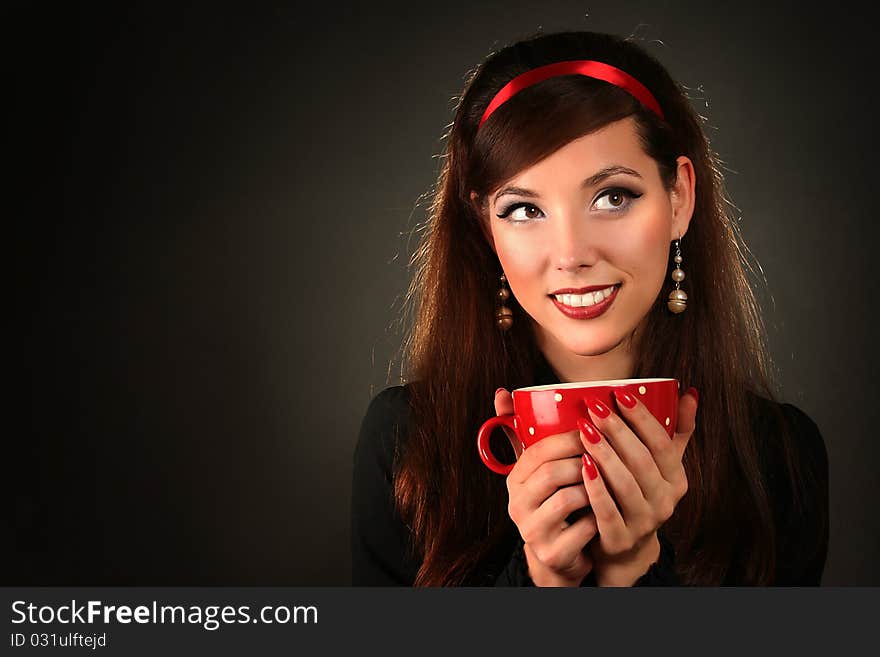 Beautiful retro woman with red cup