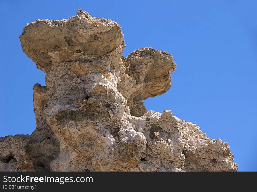 Closeup of tufa tower against blue sky, Mono Lake Tufa State Nature Reserve, near Lee Vining, CA