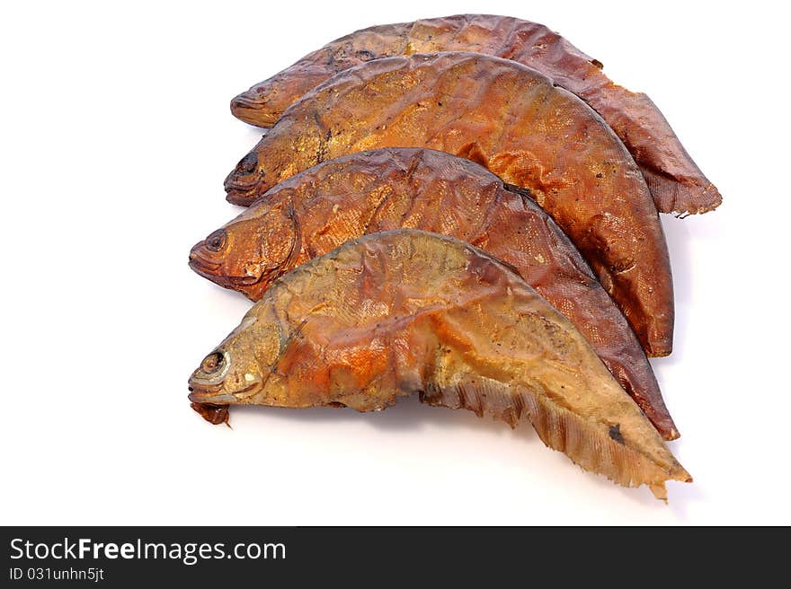 Dried fishes on white background.