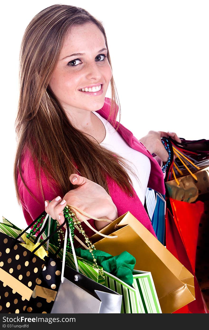 A happy girl holding shopping bags, on a white background. A happy girl holding shopping bags, on a white background.