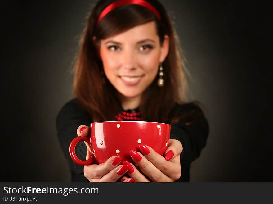 Beautiful retro woman with red cup. Beautiful retro woman with red cup