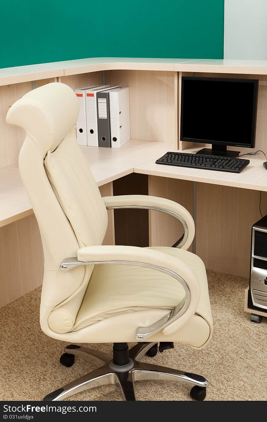 White leather armchair in a modern office