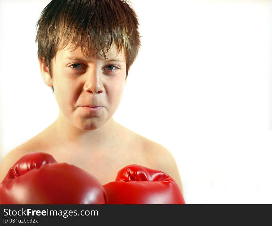 Young boxer with a red pair of boxing gloves. Young boxer with a red pair of boxing gloves