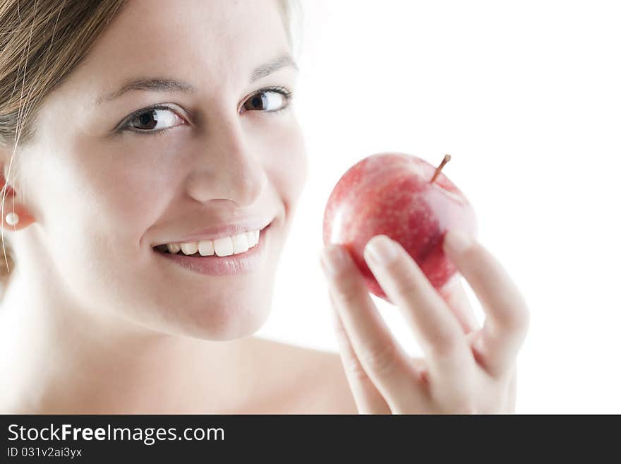 Beautiful woman eating a red apple. Beautiful woman eating a red apple