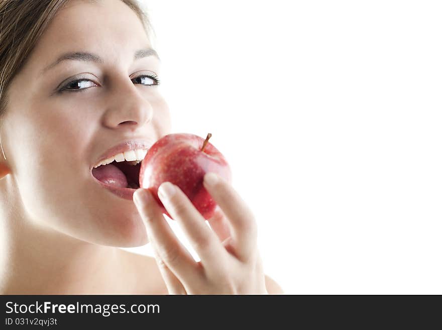 Beautiful woman eating a red apple. Beautiful woman eating a red apple