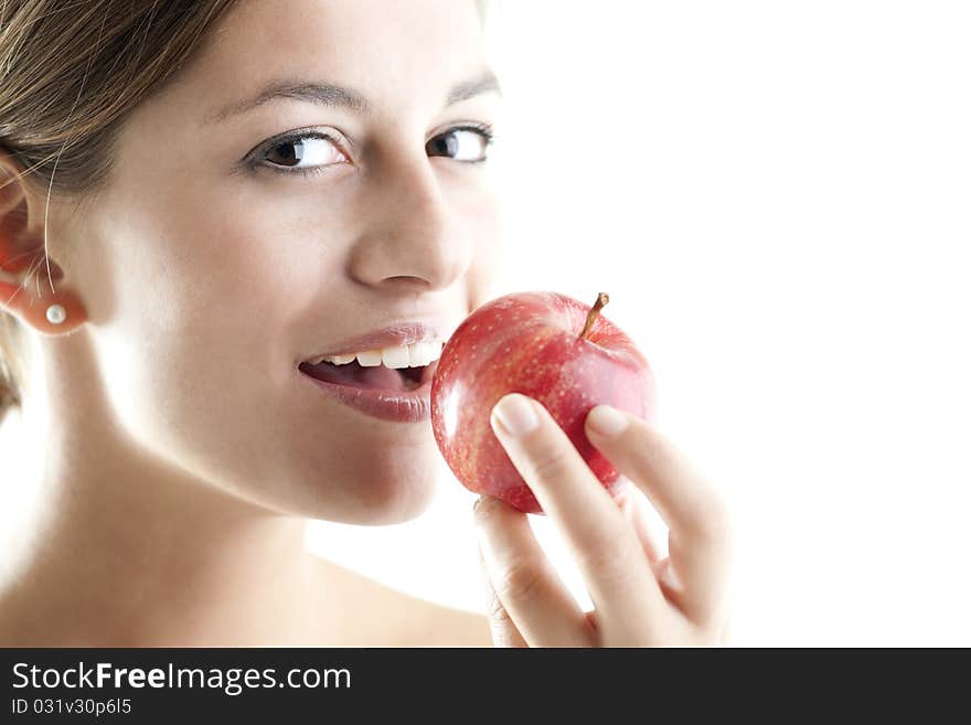 Beautiful woman eating a red apple. Beautiful woman eating a red apple