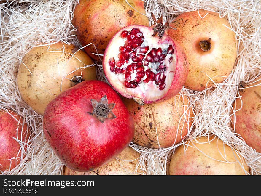 Red pomegranates in box