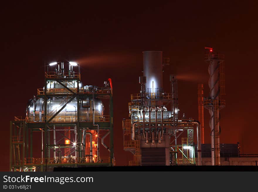 Closeup of petrochemical oil refinery factory with storage tank. Closeup of petrochemical oil refinery factory with storage tank