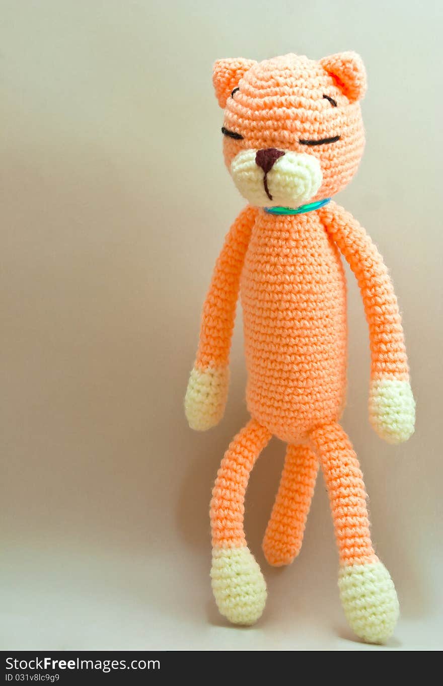 Knitted cat toy isolated on gray background