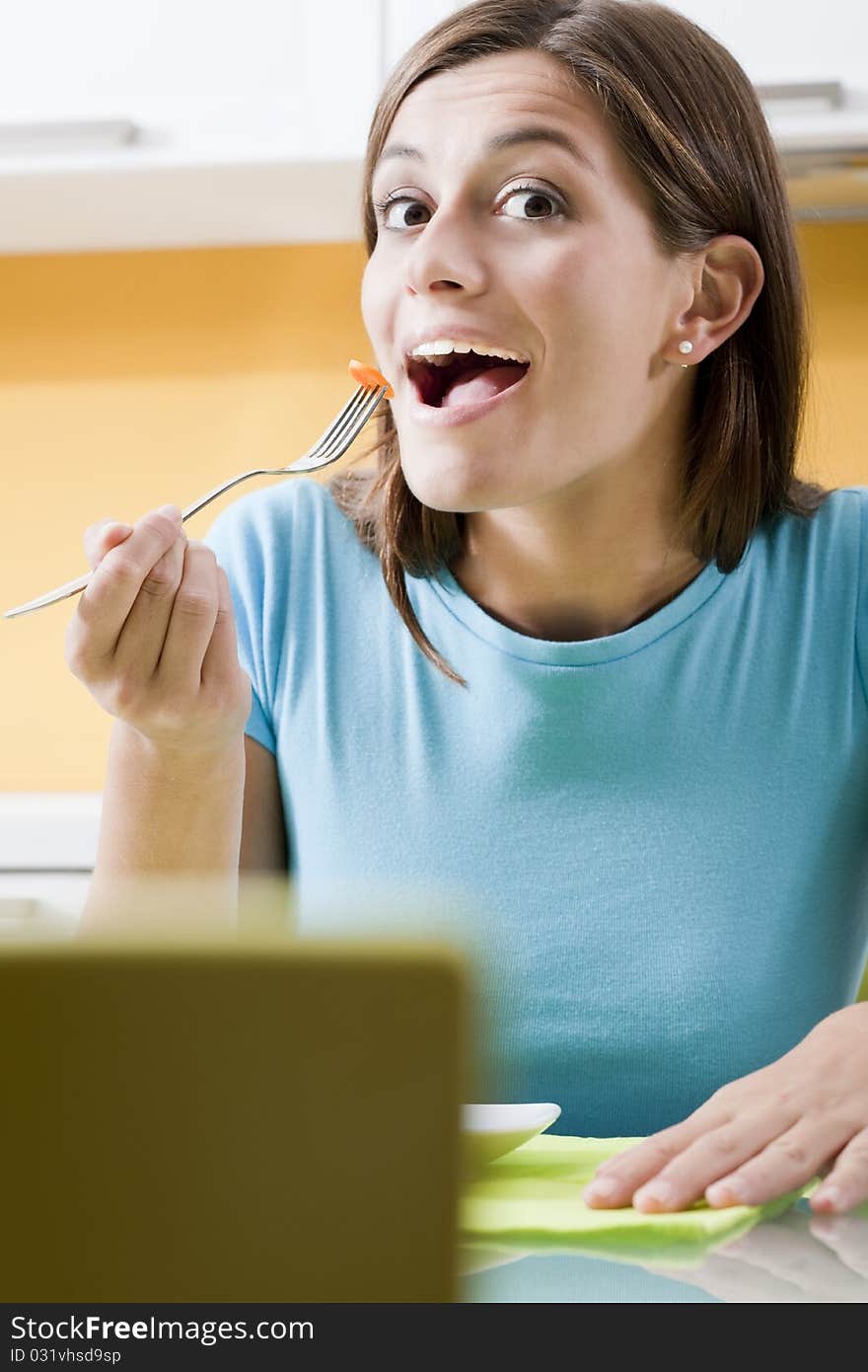 Happy Woman Eating at home