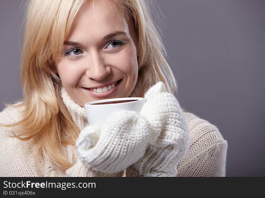 Attractive girl with a cup in his hand. Attractive girl with a cup in his hand