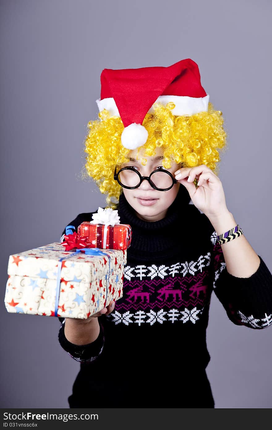 Funny Girl In Glasses With Christmas Gifts.