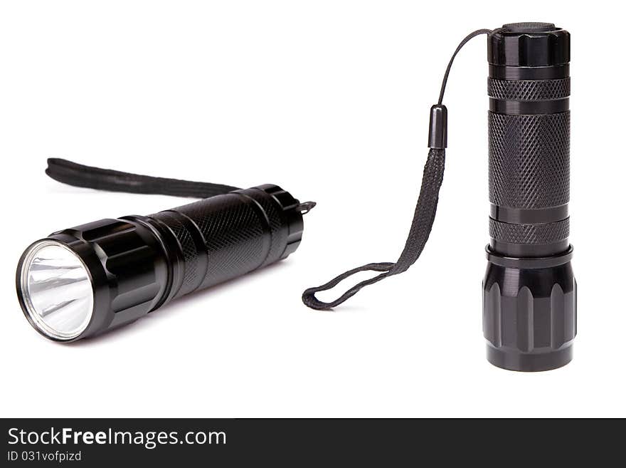 Black flashlight isolated on white background