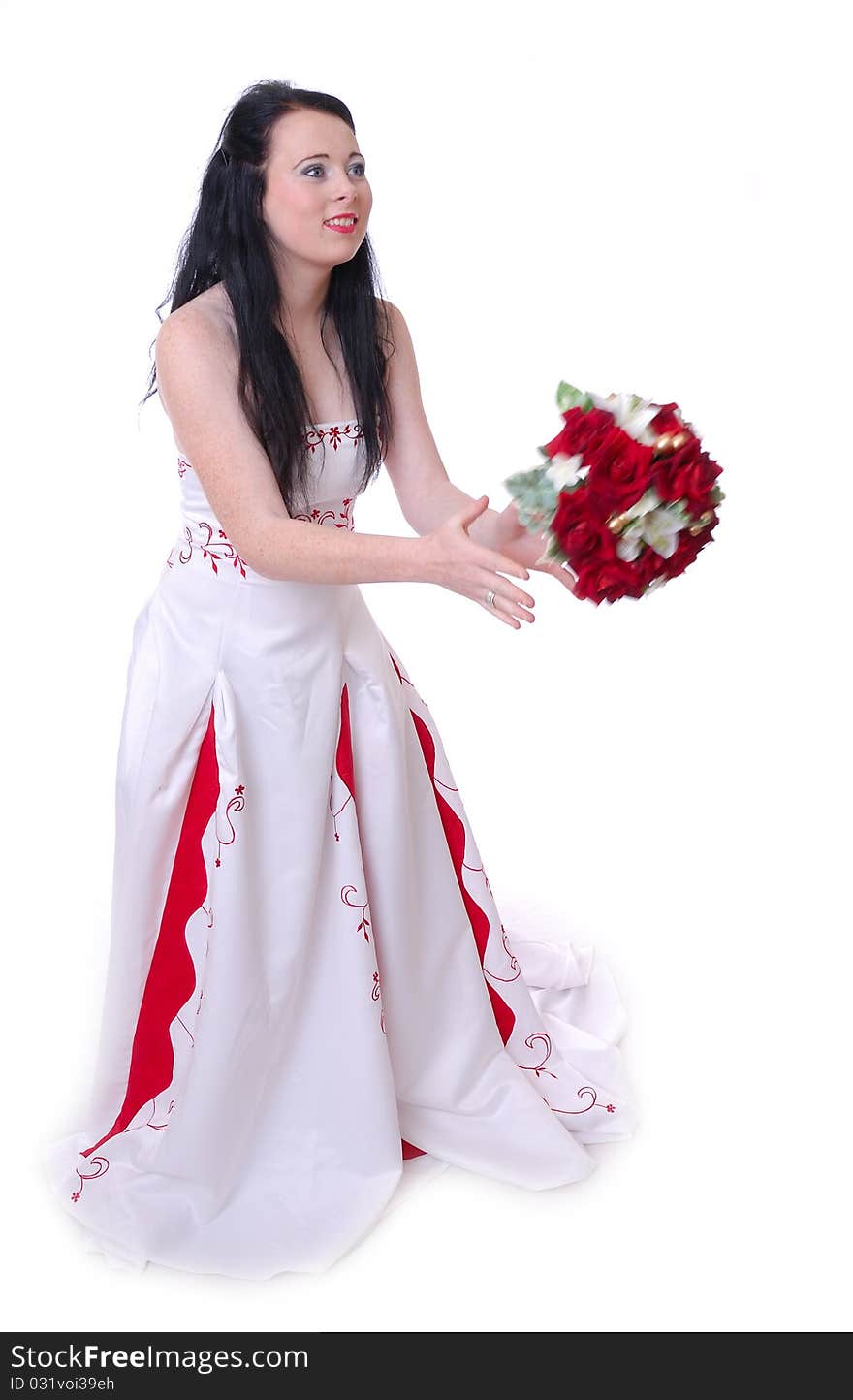 Photograph showing cute young bride in white and red wedding dress isolated against white with flowers