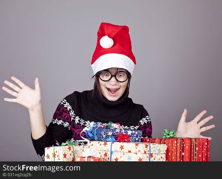 Funny Girl In Glasses With Christmas Gifts.