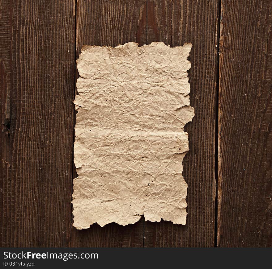 Old Paper On Brown Wood Texture