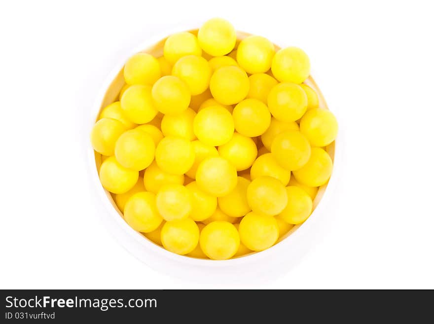 Pile of vitamin pills across white