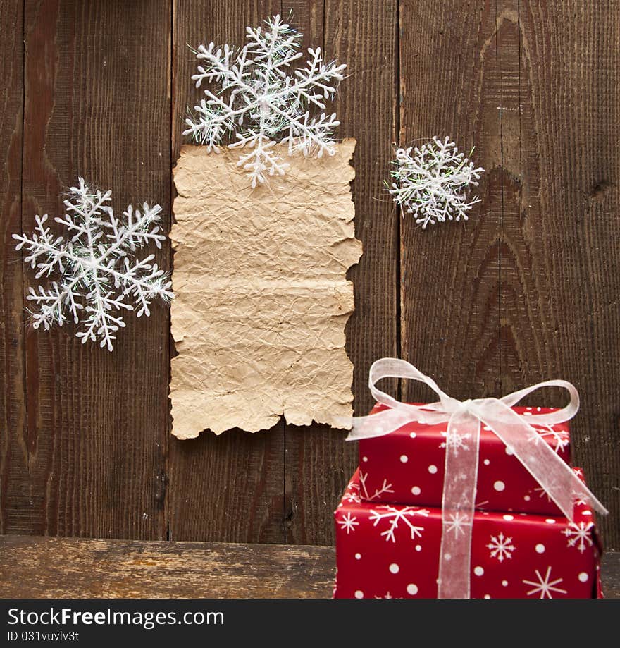 Christmas decoration and old paper on brown wood texture