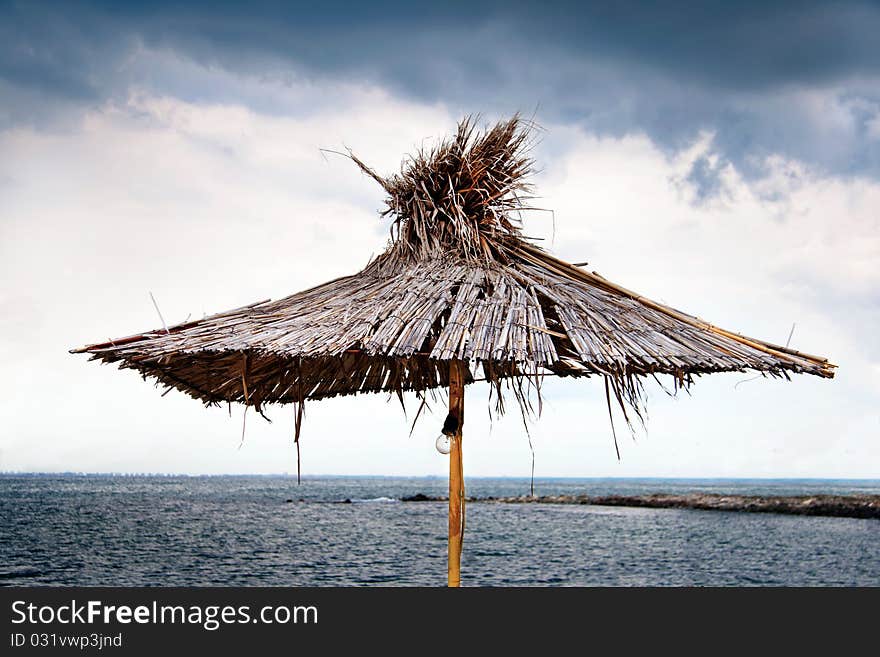 Parasol against the backdrop of a stormy sky. Parasol against the backdrop of a stormy sky.