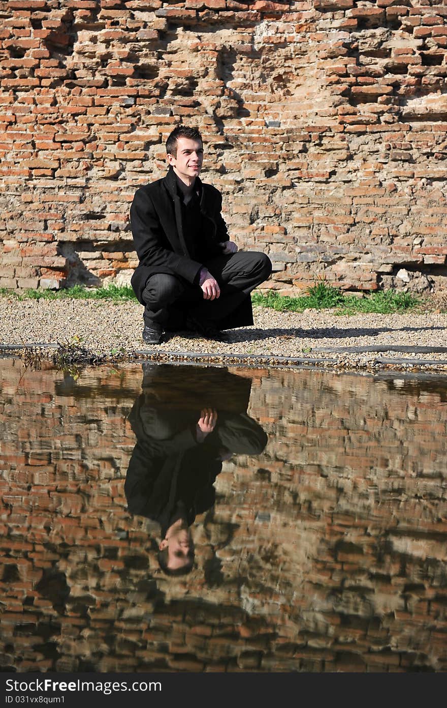 Portrait of an attractive man reflected in the lake. Portrait of an attractive man reflected in the lake