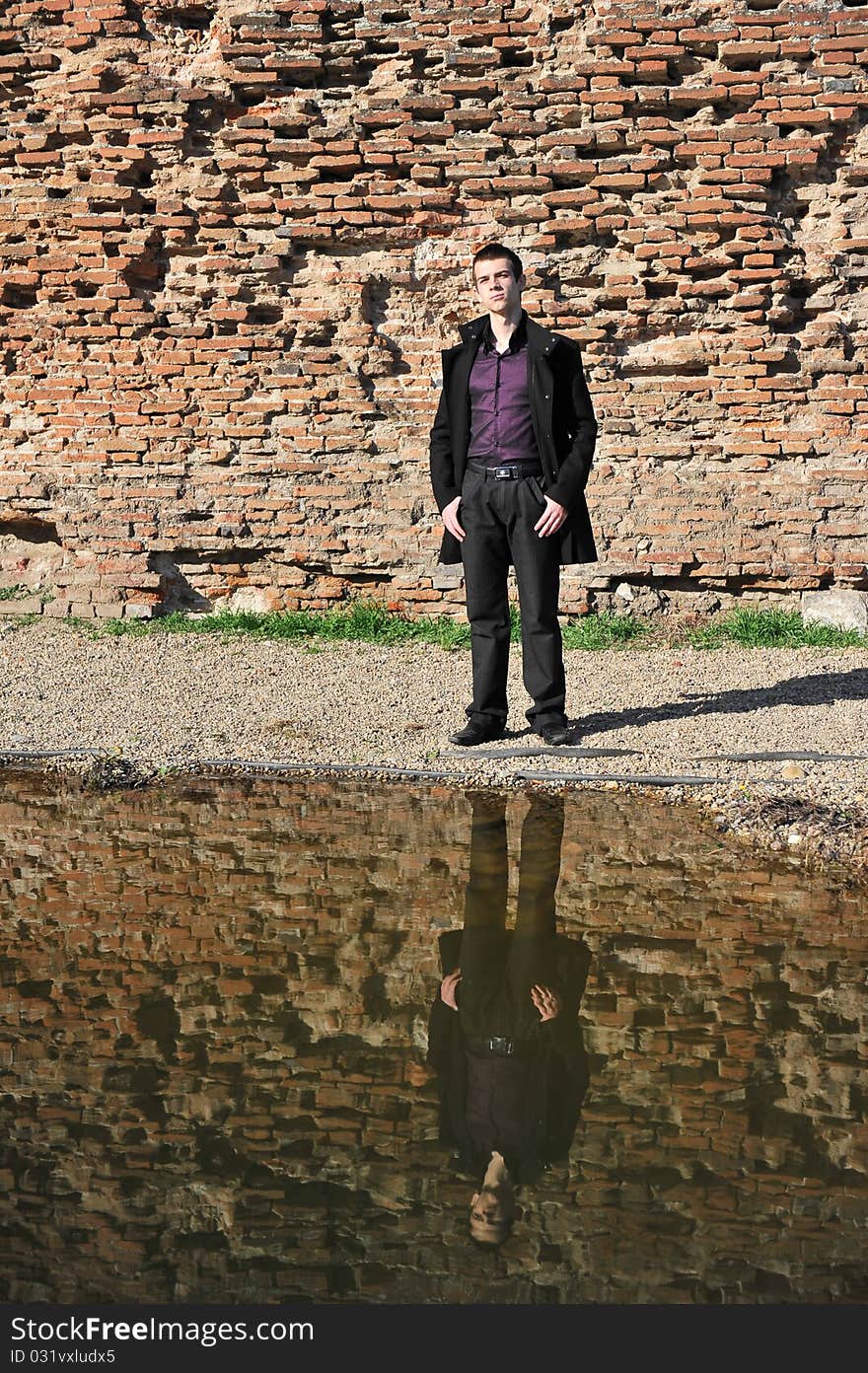 Portrait of an attractive man reflected in the lake. Portrait of an attractive man reflected in the lake