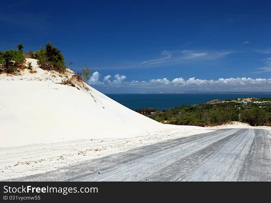 The empty road to the coast in white desert. The empty road to the coast in white desert